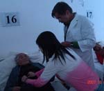 kong li helps me examine a patient